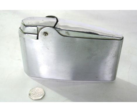 An outsized chrome table lighter in an art deco style 17cm long 