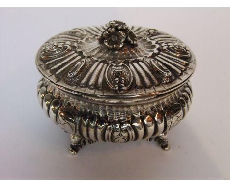 A Swedish silver caddy, possibly 1776, 830 standard, of oval form, with gadroon decoration, highlighted with floral details, 