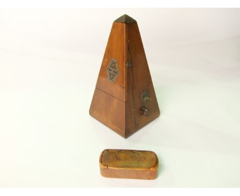 A French rosewood veneered metronome, marked Metronome De Naelzel Paris together with an antique burrwood snuff box with hing