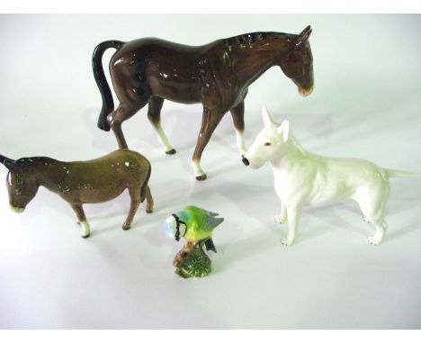 Three Beswick models comprising a Staffordshire Bull Terrier, marked to base Romany Rhinestone, a standing donkey and a boxed