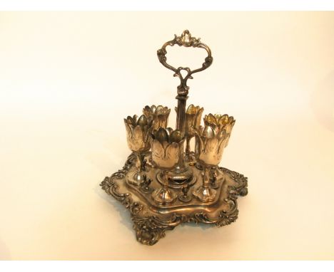A Victorian silver egg cruet stand, J.E. Terrey & Co., London, 1847, the shaped circular stand centred with leaf-capped handl