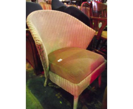 A vintage circa 1960s bedroom chair, probably Lloyd Loom, with shaped back over a drop in upholstered seat and simple splayed