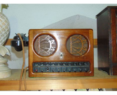 A good quality early 20th century walnut cased internal dictograph telephone system, the façade with circular cut speaker ape