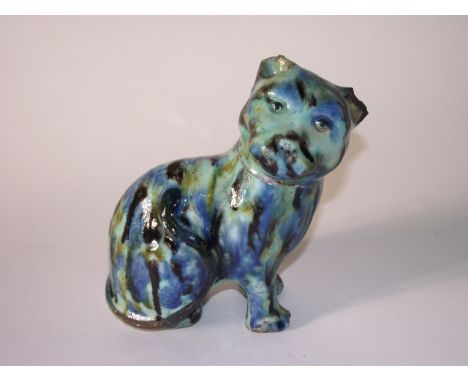 An unusual pottery model of a seated cat with mottled green and blue glazed finish, height 20cm approx
