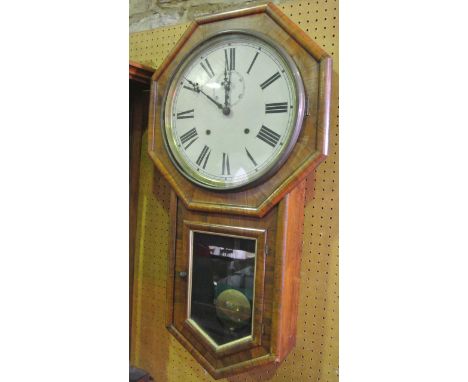 A 19th century drop dial rosewood wall clock, the octagonal surround over a glazed lower section, with eight day striking mov