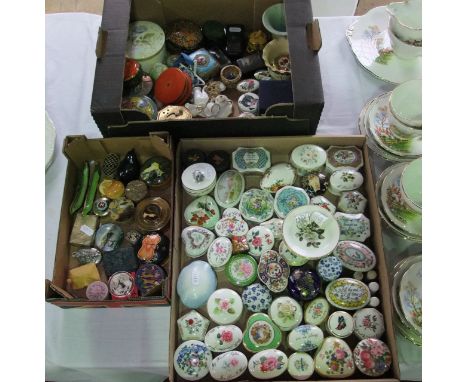 An extensive collection of ceramic, metal and other pill and trinket boxes in various designs including enamelled example in 