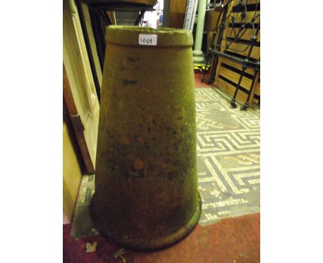 A vintage weathered terracotta conical shaped rhubarb forcer
