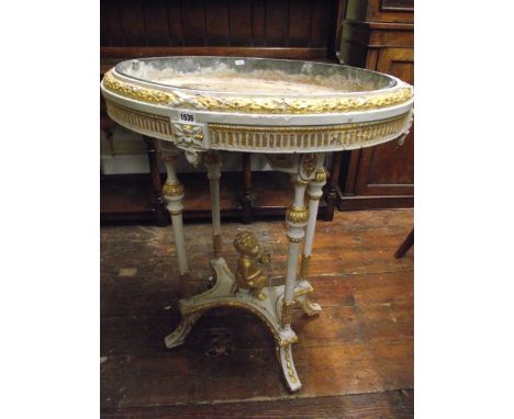 A 19th century jardinière or planter of oval form with painted and gilded framework, the oval zinc lined interior raised on f