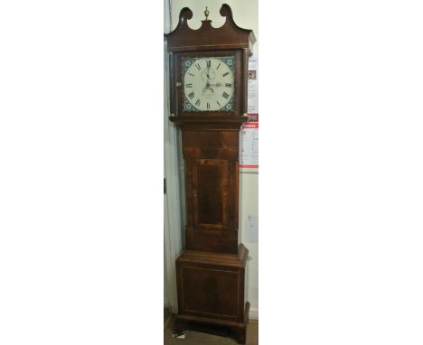 A Georgian long case clock the mahogany veneered trunk with inlaid detail beneath a broken swan neck and architectural hood e