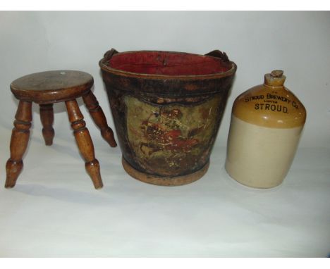 A good quality 19th century continental leather stitched bucket/pail with looping handle and applied shield cartouche with ha