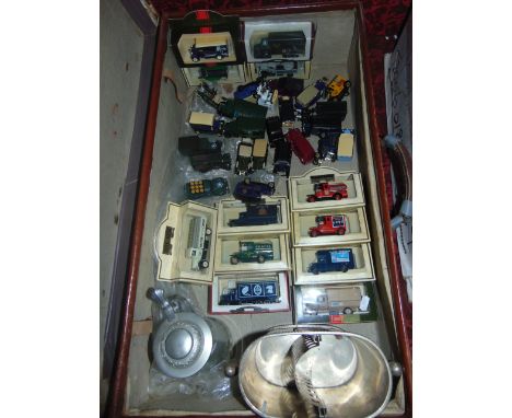 A stitched fibre suitcase containing a quantity of boxed 'Days Gone' and other die cast model vehicles, further similar unbox