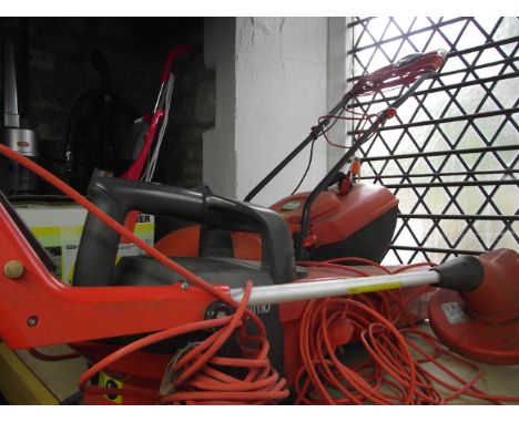 A Flymo Easimo electric lawn mower together with a further Flymo electric garden vac and Flymo multi-trim  model 250
