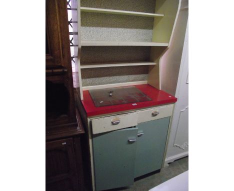 A vintage/1950s kitchen dresser with probably original cream and blue painted finish, the lower section enclosed by two doors