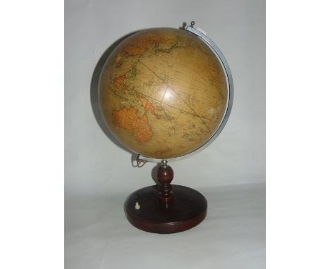 A 20th century Geographia 12 inch light up terrestrial globe, marked 55 Fleet Street, London E.C.4, raised on an electrified 