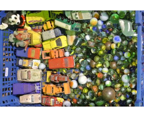 A quantity of vintage and later glass marbles together with a selection of die cast model vehicles