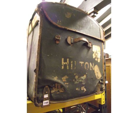 A vintage ebonised fibre and leather reinforced domed top cabin trunk bearing remains of travelling labels