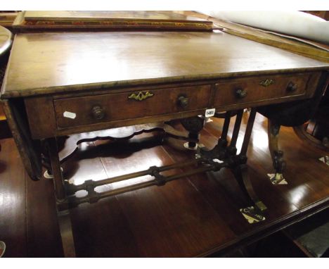 A Regency mahogany sofa table of usual form, the rectangular top incorporating two real and two dummy drawers, raised on six 