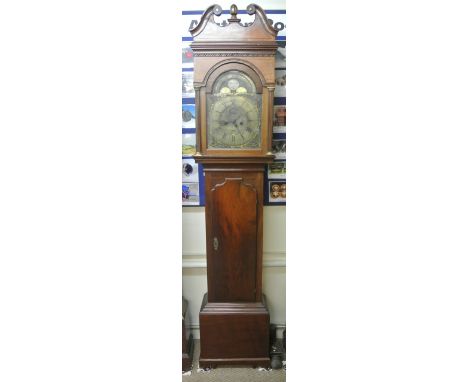 A Georgian mahogany longcase clock, the hood with reeded column supports set beneath a swan neck cornice enclosing a 31 cm br