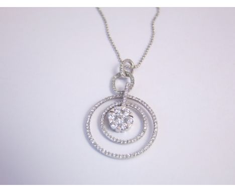 A diamond pendant, centred with a round brilliant-cut diamond weighing approximately 0.17cts, within a surround of six round 