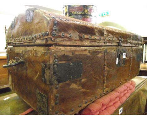 A Georgian pony skin travelling trunk carved by William Jones of New Street, Birmingham with brass stud and steel banded bord