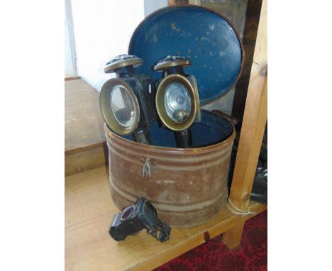 A 19th century painted tin hat box with hinged lid containing a pair of candle burning coaching lanterns, a further Lucas aut