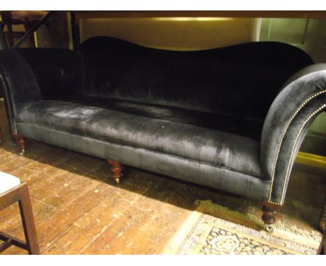 A large good quality sofa upholstered in a dark blue velvet, raised on turned supports, the shape of Georgian design, 2.5 met