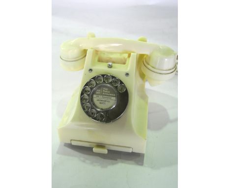 A vintage cream coloured bakelite telephone with integral drawer numbered to base 312L S53/3A and square printed stamp G.P.O