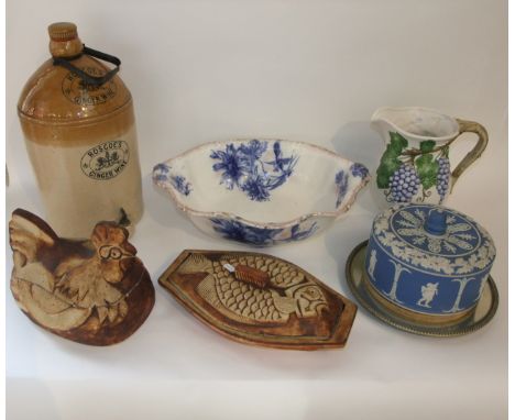 A Wedgwood blue ground Jasperware Stilton dish and cover (unmarked) with an associated silver plated stand with wooden inset,