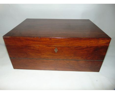 A good quality large mahogany veneered writing slope the hinged lid revealing a document shelf, set above a further hinged sl