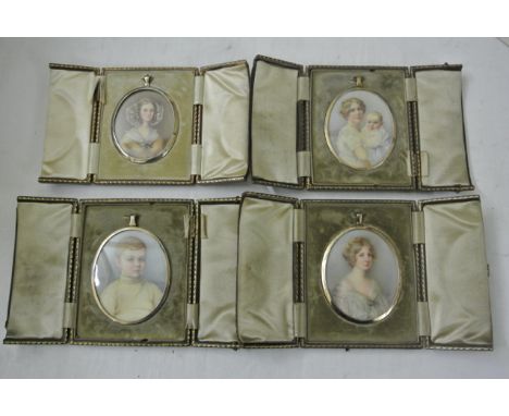 A group of four portrait miniatures of oval form comprising studies of a fair haired lady in white gauze shawl and blue brooc