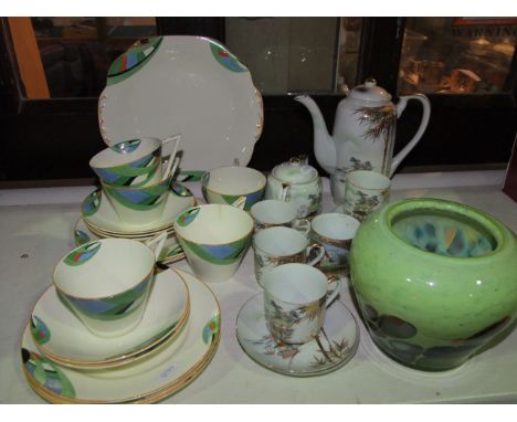 A collection of art deco tea wares with blue and green decoration including cake plate, five cups, five saucers and five tea 