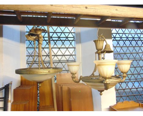 A contemporary reproduction three branch Platonier type hanging ceiling light together with one other similar