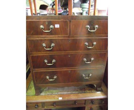 A good quality Georgian style mahogany caddy top bedroom chest of three long and two short graduated drawers with shaped apro