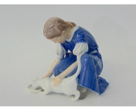 A Danish Bing & Grondhal model of a young girl feeding a cat with printed mark to base no1745, height 14cm approx