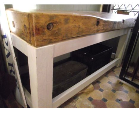 A good example of a large vintage waxed butchers block of rectangular form raised on a later painted pine bespoke stand with 