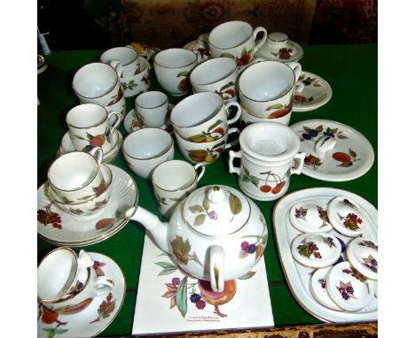 (Displayed on green baize) A quantity of Royal Worcester Arden pattern wares including teapot with offset handle, teapot stan