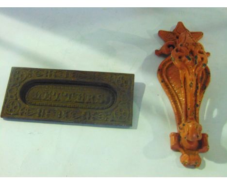A late 19th /early 20th century cast iron door knocker with painted finish by Kenrick, the design attributed to Doctor Christ