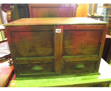 A small vintage oak mule type chest with hinged lid over a panelled frame, the front elevation intialled ER over a long drawe