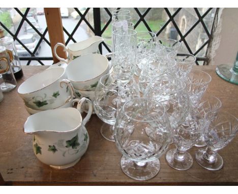 Assorted drinking glasses to include snifters, wines, flutes etc, all with similar star cut decoration together with a part c