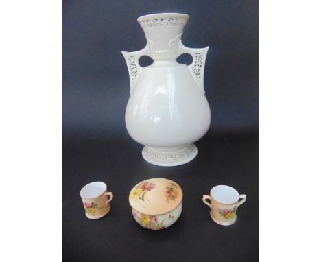 A 19th century Royal Worcester white glazed two handled vase with pierced detail to the handles and neck with printed and imp