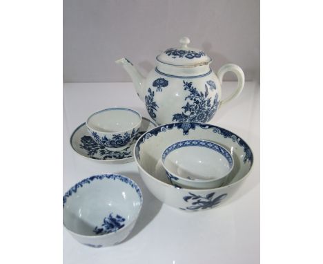 An 18th century Caughley teapot of globular form with blue chinoiserie decoration in the Three Flowers pattern with S mark to