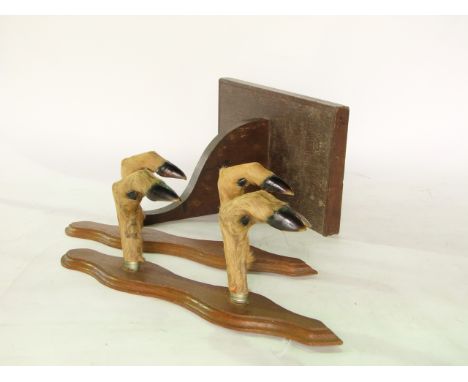 A matched pair of antique taxidermy wall hanging hat/coat racks, etched formed from deer's legs on shaped oak plaques, 40cm l