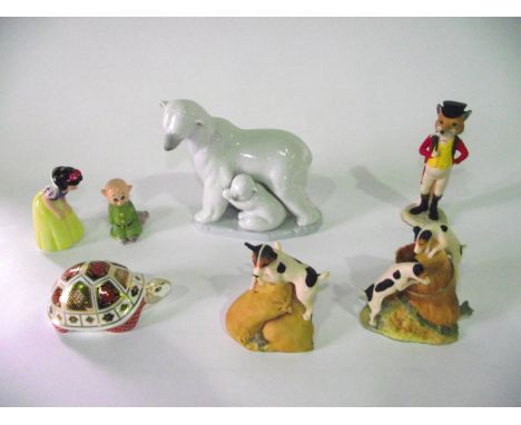 A collection of ceramics including a Lladro Daisa group of a polar bear family together with a boxed Royal Crown Derby paperw