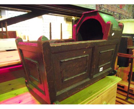 A small vintage oak cradle in the Georgian style with raised partial canopy and moulded panelled framework with applied beade