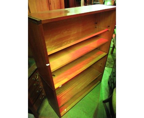 A mid 20th century floorstanding open bookcase probably of Danish design, with one central fixed shelf and three further adju