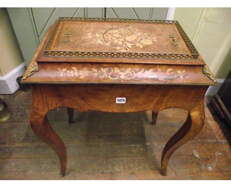 A mid-19th century walnut occasional or planter table raised on four cabriole supports, the shaped top with floral marquetry 