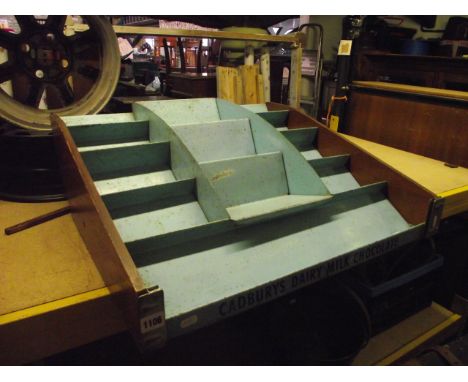 A vintage shop counter top chocolate display stand advertising Cadburys Dairy Milk Chocolate, teak framed with light blue pai