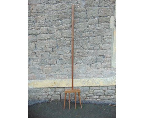 A vintage agricultural long handled four-pronged fork