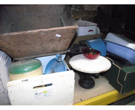 A quantity of kitchenalia, mainly enamel wares, a vintage tin food cabinet/safe, cast iron kitchen scale, a small quantity of