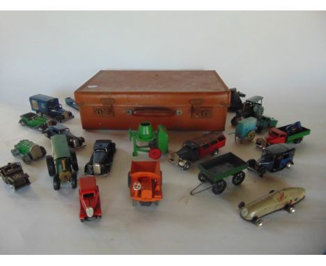 A small stitched composite suitcase containing selected vintage diecast models of vehicles to include a Tri-and mimic collect
